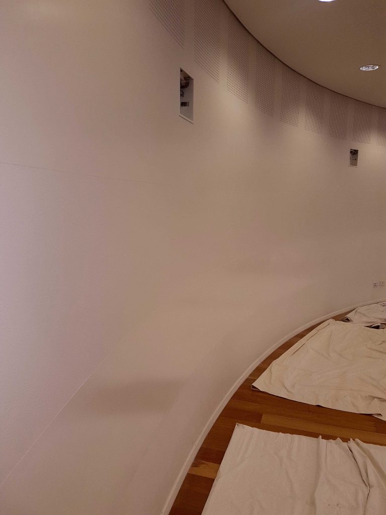 Curved plaster ceiling detail showing the smooth finish achieved on shaped work