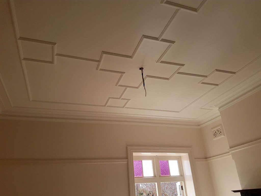 Geometric plaster ceiling mouldings forming decorative panels in a Federation home in Sydney