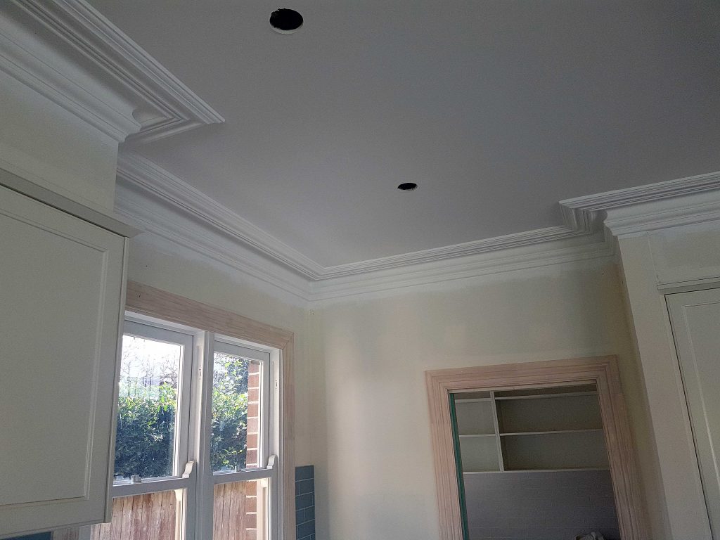 Decorative plaster cornice running along the wall and ceiling junction in a Sydney home