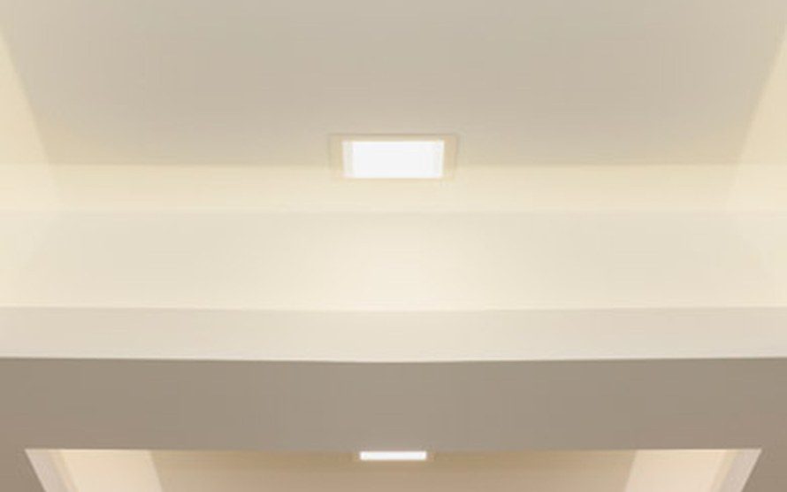 Stepped plasterboard ceiling with a recessed downlight