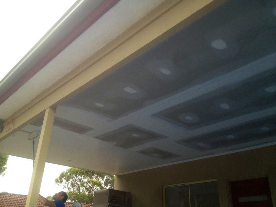 Plasterboard ceiling with set joints and patched fixings